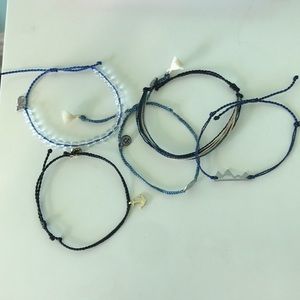 4 Pura Vida Bracelets and one 4Ocean bracelet
